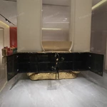 Luxury TV Stand with Bold Stone Top Textured Dark Finish Sculptural Stainless Steel Base and Cabinet Storage